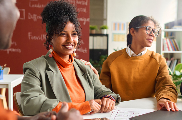 image of 2 staff members smiling